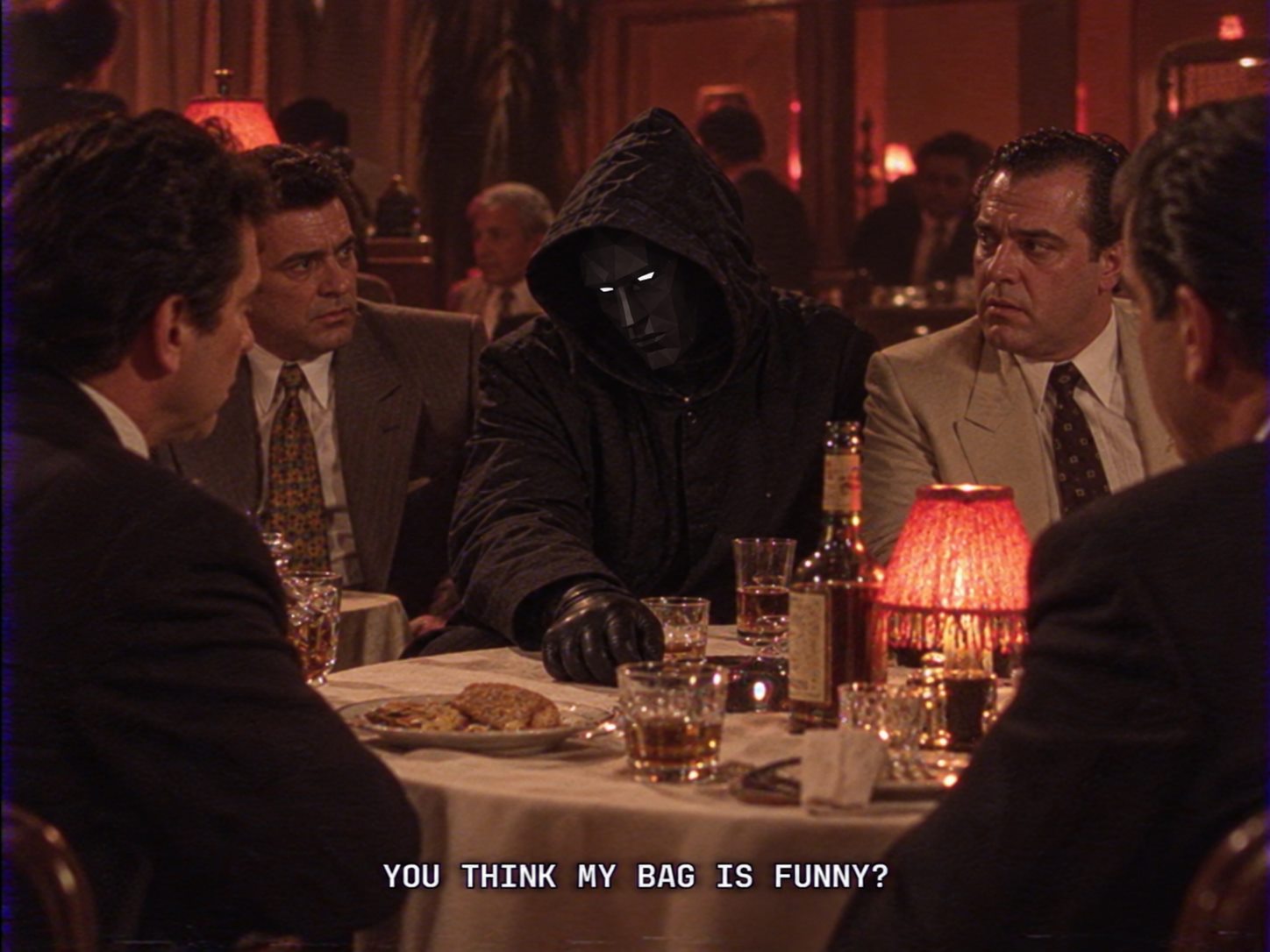 The N/A hooded figure seated at a restaurant table with the caption You think my bag is funny?
